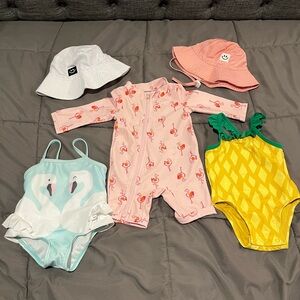Lot of baby girls swim suits and sun hats